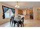 Bright dining area with dark wood table and kitchen view at 12610 Geneva Glade Dr, Riverview, FL 33578