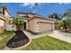 Two-story house with a two-car garage and well-maintained landscaping at 12610 Geneva Glade Dr, Riverview, FL 33578