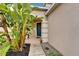 Inviting front entrance with teal door and lush landscaping at 12610 Geneva Glade Dr, Riverview, FL 33578