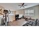 Home gym with elliptical, weight bench, and TV at 12610 Geneva Glade Dr, Riverview, FL 33578