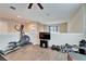 Home gym in loft with elliptical and weights at 12610 Geneva Glade Dr, Riverview, FL 33578