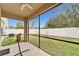 Screened-in porch with backyard view at 12610 Geneva Glade Dr, Riverview, FL 33578