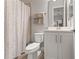 Bathroom with shower/tub combo, white vanity, and neutral decor at 13008 Weatherstone Dr, Spring Hill, FL 34609