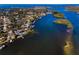 Aerial view showcasing waterfront property and neighborhood at 1302 Belcher Dr, Tarpon Springs, FL 34689