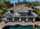 House with pool and patio, seen from above at 1302 Belcher Dr, Tarpon Springs, FL 34689