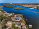 Stunning aerial view of waterfront home and landscape at 1302 Belcher Dr, Tarpon Springs, FL 34689