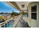 Relaxing balcony with a view of the pool and water at 1302 Belcher Dr, Tarpon Springs, FL 34689