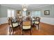 Formal dining room with round table and chandelier at 1302 Belcher Dr, Tarpon Springs, FL 34689