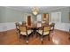 Classic dining room with round table and chandelier at 1302 Belcher Dr, Tarpon Springs, FL 34689