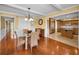 Casual dining area with glass table and kitchen access at 1302 Belcher Dr, Tarpon Springs, FL 34689