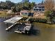 Wooden dock and boathouse on the water at 1302 Belcher Dr, Tarpon Springs, FL 34689