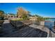 Wooden dock with seating overlooking the water at 1302 Belcher Dr, Tarpon Springs, FL 34689