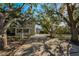 House with a long driveway and lush trees at 1302 Belcher Dr, Tarpon Springs, FL 34689