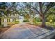 Long driveway leading to a two-story house at night at 1302 Belcher Dr, Tarpon Springs, FL 34689