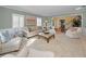 Living room with neutral decor, fireplace, and view into adjacent dining area at 1302 Belcher Dr, Tarpon Springs, FL 34689