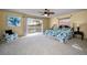 Spacious main bedroom with water views, king bed, and ceiling fan at 1302 Belcher Dr, Tarpon Springs, FL 34689