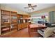 Home office with built-in shelving, hardwood floors, and water views at 1302 Belcher Dr, Tarpon Springs, FL 34689