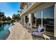 Relaxing patio area with wicker chairs near the pool at 1302 Belcher Dr, Tarpon Springs, FL 34689