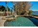 Relaxing spa and refreshing pool with lush landscaping at 1302 Belcher Dr, Tarpon Springs, FL 34689