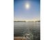 Peaceful waterfront view at night with a full moon at 1302 Belcher Dr, Tarpon Springs, FL 34689