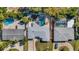 Aerial view of a home with multiple pools and lush landscaping at 1320 Dixie S Ln, St Petersburg, FL 33707