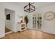 Elegant dining area with hardwood floors, french doors, and a modern chandelier at 1320 Dixie S Ln, St Petersburg, FL 33707