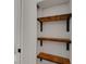 Built-in shelving unit with wood shelves at 1320 Dixie S Ln, St Petersburg, FL 33707