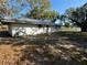 Home's back elevation with large yard at 1417 Murillo Loop, Ruskin, FL 33570