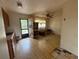 Kitchen features wood cabinets and tiled floor at 1417 Murillo Loop, Ruskin, FL 33570