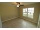 Bright bedroom with large window and ceiling fan at 156 Grand Ave, Brooksville, FL 34604