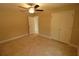 Bedroom with double door closet and ceiling fan at 156 Grand Ave, Brooksville, FL 34604