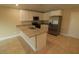 Modern kitchen with granite countertops and stainless steel appliances at 156 Grand Ave, Brooksville, FL 34604