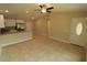 Bright and spacious living room with tile floors and ceiling fan at 156 Grand Ave, Brooksville, FL 34604