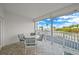 Spacious balcony overlooking the ocean with outdoor furniture at 1582 Gulf Blvd # 1108, Clearwater Beach, FL 33767