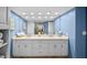 Double vanity bathroom with updated white cabinets at 1582 Gulf Blvd # 1108, Clearwater Beach, FL 33767