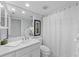 Clean bathroom with white vanity, toilet and shower at 1582 Gulf Blvd # 1108, Clearwater Beach, FL 33767