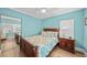 Bright bedroom with wooden furniture and large mirrored closet at 1582 Gulf Blvd # 1108, Clearwater Beach, FL 33767