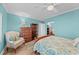 Serene bedroom with light blue walls and a comfortable sitting area at 1582 Gulf Blvd # 1108, Clearwater Beach, FL 33767