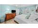 Bedroom with a king-size bed and wood dresser at 1582 Gulf Blvd # 1108, Clearwater Beach, FL 33767