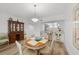 Bright dining area with hardwood floors and a charming wooden table at 1582 Gulf Blvd # 1108, Clearwater Beach, FL 33767