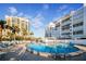 Community pool with plenty of lounge chairs at 1582 Gulf Blvd # 1108, Clearwater Beach, FL 33767