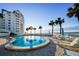 Inviting pool area with ocean views and lounge chairs at 1582 Gulf Blvd # 1108, Clearwater Beach, FL 33767