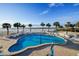 Resort-style pool with ocean views and palm trees at 1582 Gulf Blvd # 1108, Clearwater Beach, FL 33767