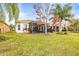 Home with screened patio and beautifully landscaped backyard at 16051 Golden Lakes Dr, Wimauma, FL 33598