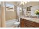 Bathroom features a tub, toilet and granite vanity at 16051 Golden Lakes Dr, Wimauma, FL 33598