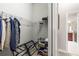 Spacious walk-in closet with shelving and hanging rods at 16051 Golden Lakes Dr, Wimauma, FL 33598