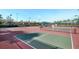 Outdoor pickleball courts with seating area at 16051 Golden Lakes Dr, Wimauma, FL 33598