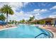 Expansive pool area with comfortable seating at 16051 Golden Lakes Dr, Wimauma, FL 33598