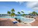Relaxing resort-style pool with lounge chairs at 16051 Golden Lakes Dr, Wimauma, FL 33598
