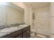 Bathroom with double vanity, granite countertop, and bathtub at 17048 Oval Rum Dr, Wimauma, FL 33598